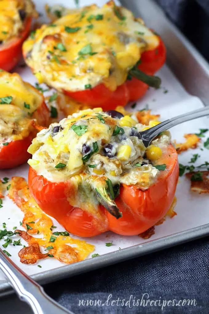 Cheesy chicken stuffed peppers served on a plate