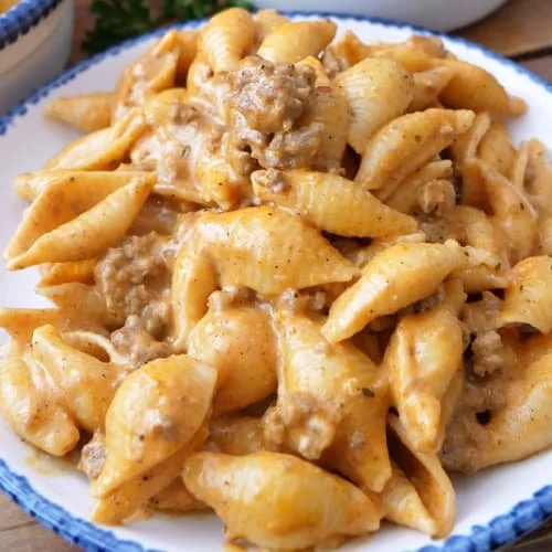 Creamy beef pasta with cheese served in a bowl