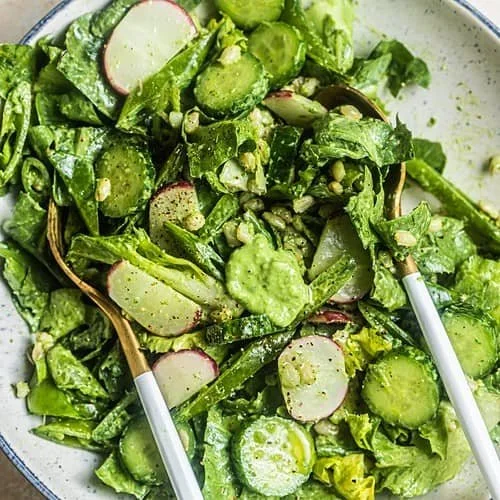 Creamy lettuce salad with butter, garnished for a fresh and tasty side dish.