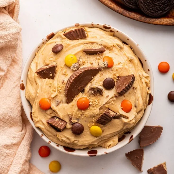 Creamy peanut butter cup dip served with fruits and snacks