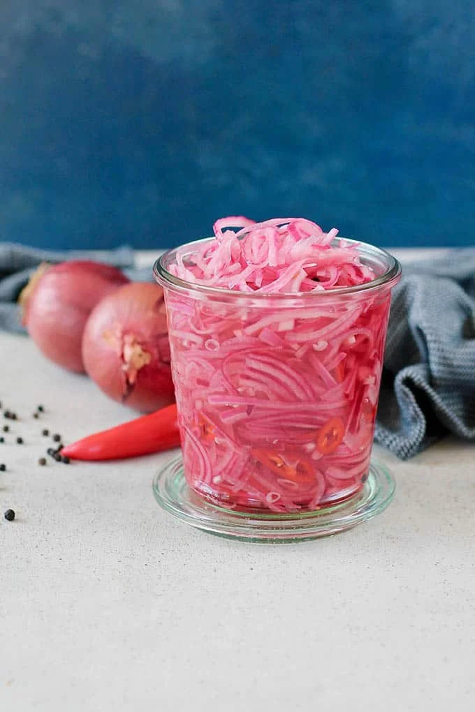 Delicious fiery pickled onions in a jar, ready to spice up any dish