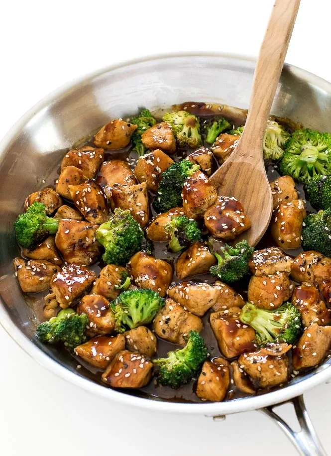Honeyed garlic chicken stir fry with colorful vegetables in a bowl