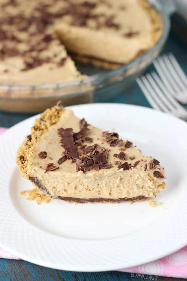 Delicious no-bake peanut butter chocolate pie topped with chocolate and peanuts