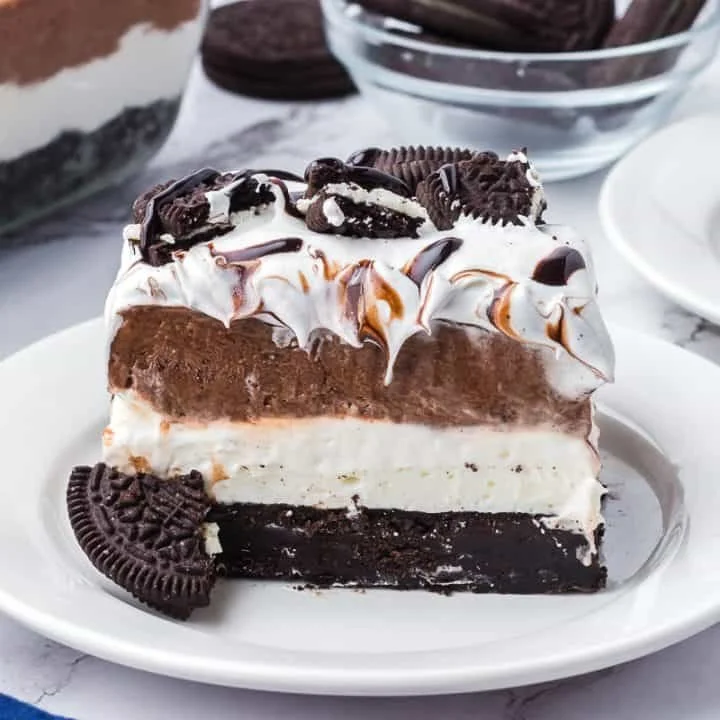 Delicious Oreo no-bake layered dessert with crushed cookies and cream layers
