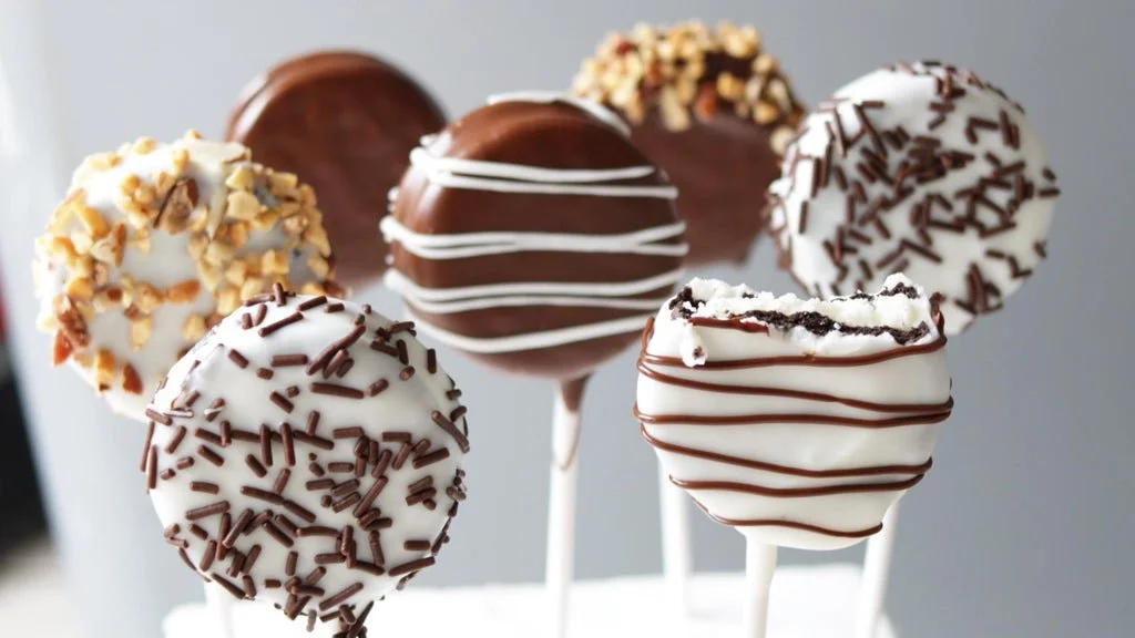 Homemade Oreo Pops, chocolate-covered Oreo cookies on sticks.