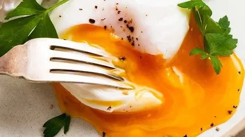 Delicious poached eggs served on toast with herbs