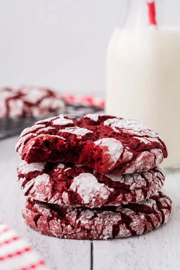 Freshly baked Red Velvet Cake Mix Cookies on a cooling rack.