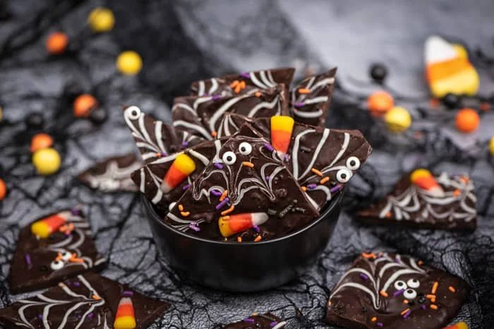 Spooky Halloween chocolate bark with festive decorations and colors