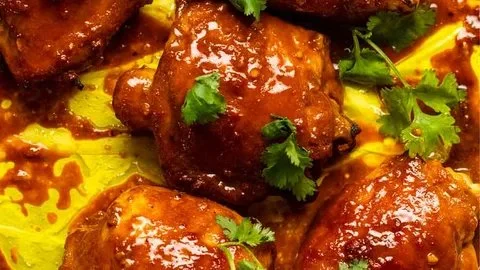 Delicious Thai Turmeric Grilled Chicken garnished with herbs and spices